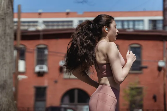 A woman jogging through the city